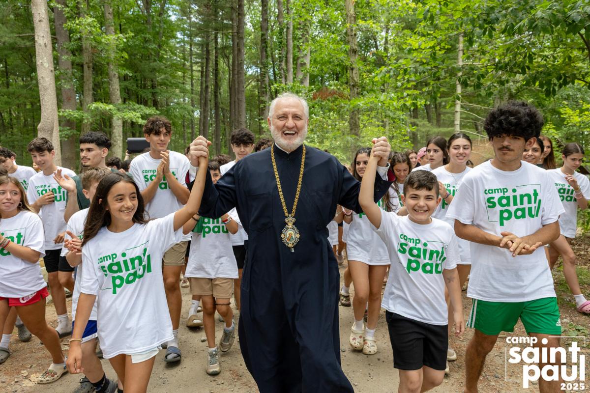 His Eminence Archbishop Elpidophoros surrounded by joyful campers at Camp Saint Paul, 2025.