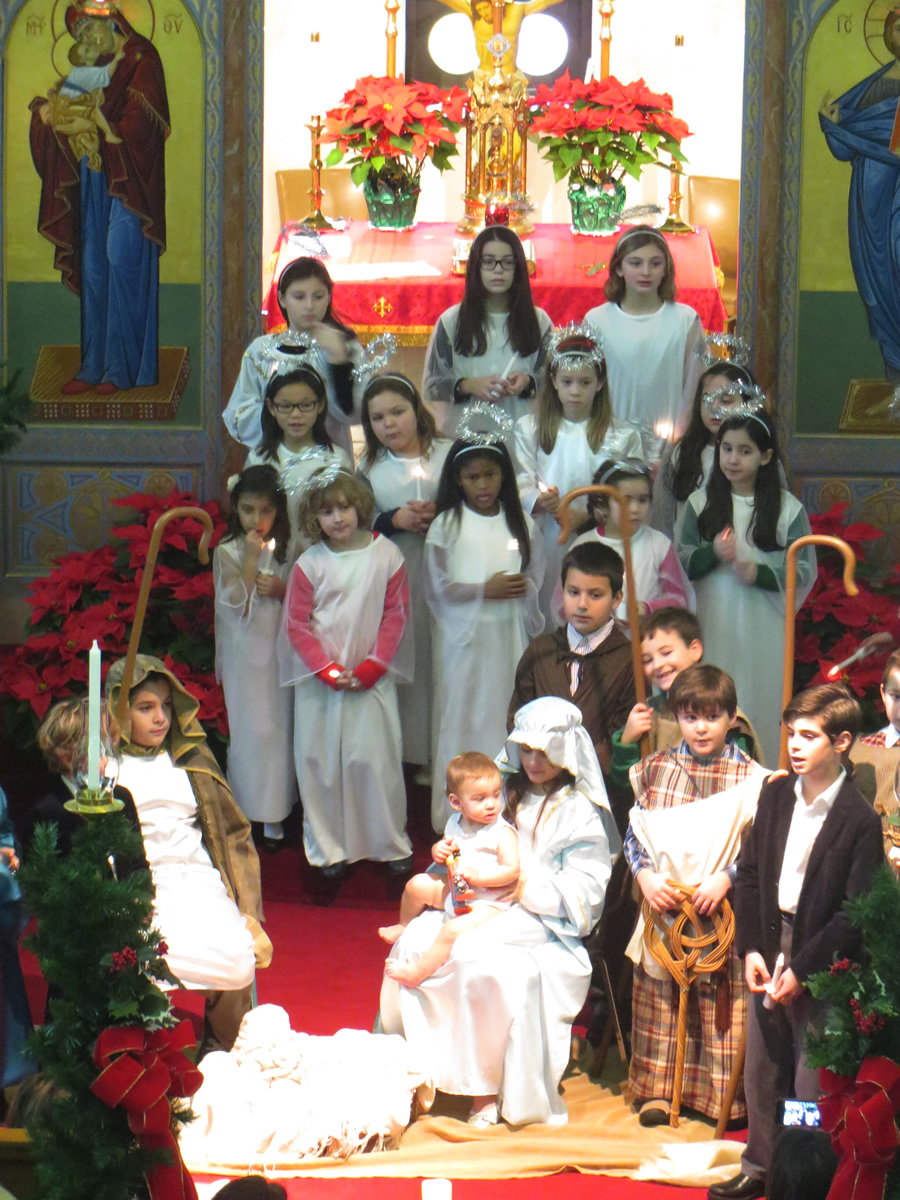Children in costume for the nativity pageant, gathered in the church nave.